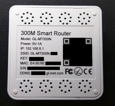 Rear of the MT300N with Model number, Power rating, Management IP, SSID, Wireless Key, MAC, Serial and Dynamic DNS address