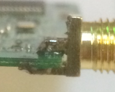 Image of RP-SMA with cut pins soldered close to PCB Image of RP-SMA with cut pins soldered close to PCB